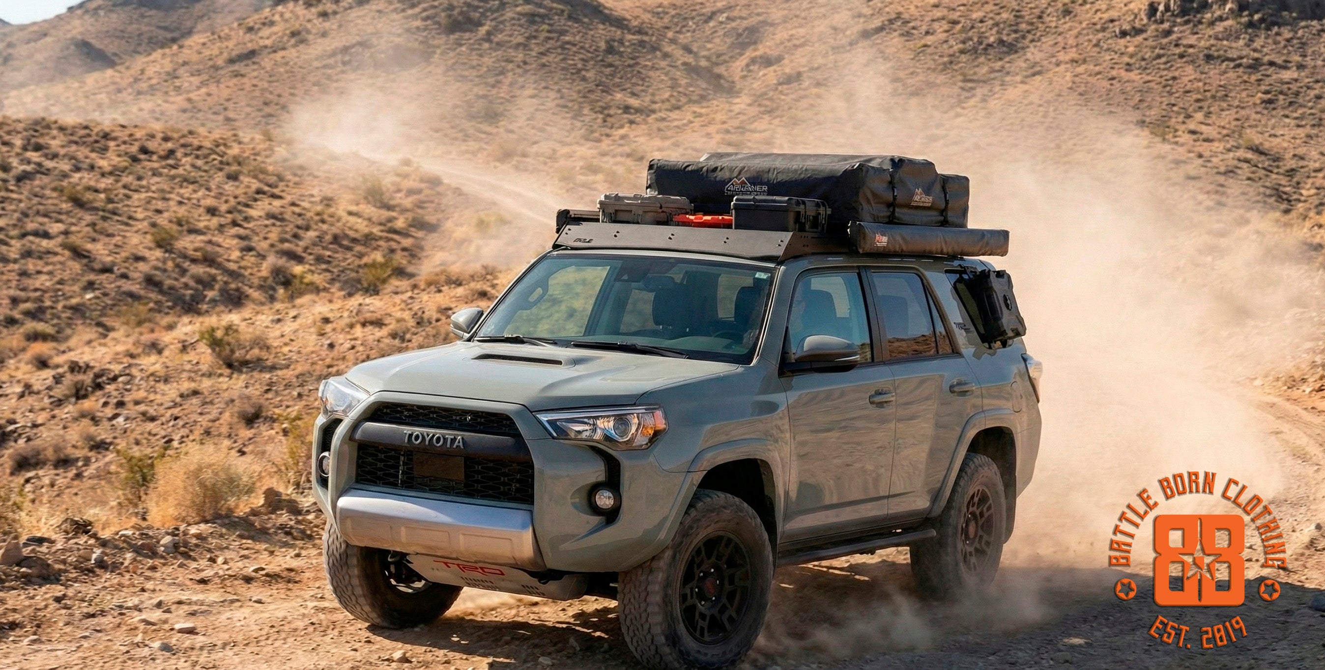 The fully-equipped 4Runner kicking up dust on a Nevada trail, ready for any adventure.