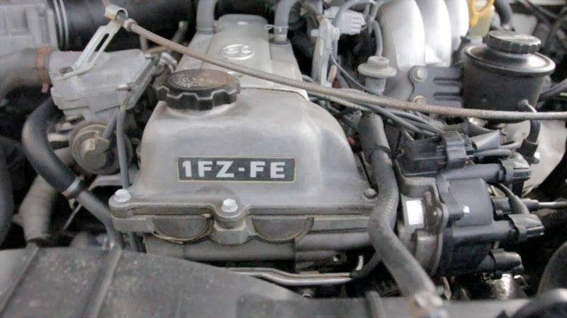 1FZ-FE engine bay in a Toyota FZJ80 Land Cruiser - Battle Born Clothing