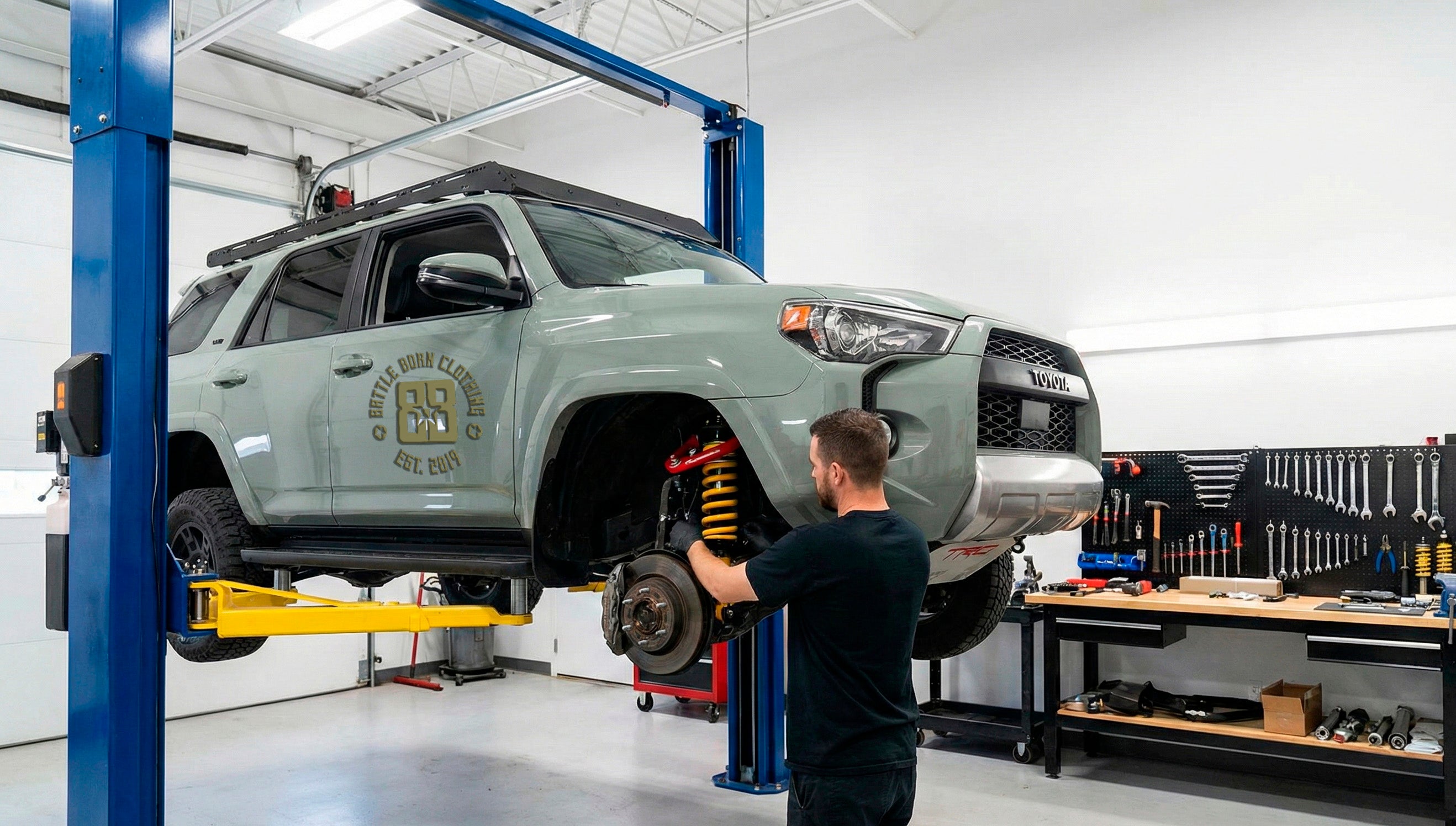 A 4Runner getting a suspension upgrade in the shop, the first step to a capable overland build.